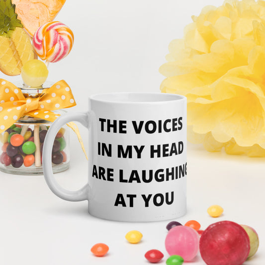 THE VOICES IN MY HEAD ARE LAUGHING AT YOU- White glossy mug